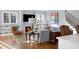 Bright living room featuring a fireplace, shelving, and lovely hardwood floors at 2721 Sanctuary Woods Ln, Raleigh, NC 27606
