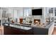 Cozy living room with a fireplace, comfortable seating, and stylish decor at 2721 Sanctuary Woods Ln, Raleigh, NC 27606