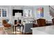 Cozy living room with fireplace, comfortable seating, hardwood floors and natural light at 2721 Sanctuary Woods Ln, Raleigh, NC 27606