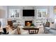 Inviting living room with marble fireplace, built-in shelves, and comfortable seating arrangement at 2721 Sanctuary Woods Ln, Raleigh, NC 27606