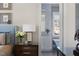 Comfortable main bedroom leads into ensuite bath with diamond patterned tile wall and modern finishes at 2721 Sanctuary Woods Ln, Raleigh, NC 27606