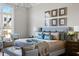 Comfortable main bedroom featuring a sitting area and large window providing natural light at 2721 Sanctuary Woods Ln, Raleigh, NC 27606