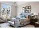 Bright main bedroom features a king-size bed, matching nightstands, and a large window with a backyard view at 2721 Sanctuary Woods Ln, Raleigh, NC 27606
