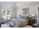 Comfortable main bedroom featuring a sitting area and large window providing natural light at 2721 Sanctuary Woods Ln, Raleigh, NC 27606