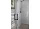 Modern shower showcasing white tile, glass enclosure, and stylish fixtures at 2721 Sanctuary Woods Ln, Raleigh, NC 27606