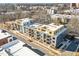Modern apartment building with rooftop deck featuring outdoor seating and stylish architectural details in an urban setting at 29 Enterprise St # 309, Raleigh, NC 27607