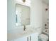 Modern bathroom features white tiles, stylish fixtures, and a sleek, frameless mirror at 29 Enterprise St # 309, Raleigh, NC 27607