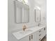 Modern bathroom features double vanity with white countertops and gold fixtures at 29 Enterprise St # 309, Raleigh, NC 27607