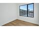 Bright bedroom features hardwood floors and a large window overlooking the outdoors at 29 Enterprise St # 309, Raleigh, NC 27607