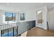 Bright, open hallway features hardwood floors, large windows, and modern railings at 29 Enterprise St # 309, Raleigh, NC 27607