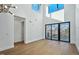 Bright living room boasts high ceilings, large windows, and hardwood flooring throughout at 29 Enterprise St # 309, Raleigh, NC 27607