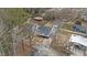 Aerial view showing a new house on a lot with surrounding trees and neighboring houses at 2917 State St, Durham, NC 27704