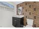 Contemporary bathroom with patterned wallpaper and vanity at 2917 State St, Durham, NC 27704