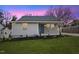 Newly renovated house with gray siding, landscaping, and a covered porch at 2917 State St, Durham, NC 27704