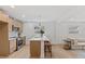 Modern kitchen with light wood cabinets and a large island at 2917 State St, Durham, NC 27704