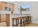 Kitchen island with seating for three and a quartz countertop at 2917 State St, Durham, NC 27704