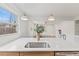Modern kitchen sink with a quartz countertop and gold faucet at 2917 State St, Durham, NC 27704