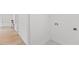 Bright laundry room with tile floor and built-in shelving at 2917 State St, Durham, NC 27704