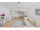 Bright living room with beige sectional sofa and view into kitchen at 2917 State St, Durham, NC 27704