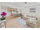 Bright living room with beige sectional sofa and view into kitchen at 2917 State St, Durham, NC 27704