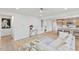 Bright living room with beige sectional sofa and view into kitchen at 2917 State St, Durham, NC 27704