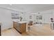 Open concept living and kitchen area with light flooring and neutral colors at 2917 State St, Durham, NC 27704