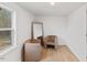 Small room with two chairs and a large mirror at 2917 State St, Durham, NC 27704