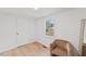 Small room with a chair and window, ideal as an office or dressing room at 2917 State St, Durham, NC 27704