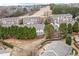 Aerial view of a community featuring manicured backyards, a golf course, and lush greenery at 3020 Imperial Oaks Dr, Raleigh, NC 27614