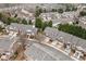 Aerial view of a residential area showcasing well-maintained homes and a tree-lined street at 3020 Imperial Oaks Dr, Raleigh, NC 27614