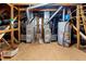 This attic houses two furnaces, a hot water tank and ductwork at 3020 Imperial Oaks Dr, Raleigh, NC 27614