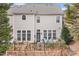 Two-story home showcasing a patio area with sliding glass doors and a well-maintained backyard at 3020 Imperial Oaks Dr, Raleigh, NC 27614