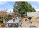 A backyard with a grill, seating, and a privacy fence at 3020 Imperial Oaks Dr, Raleigh, NC 27614