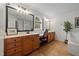 Spacious bathroom boasts double sinks, a makeup vanity, and large windows for natural light at 3020 Imperial Oaks Dr, Raleigh, NC 27614