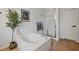 Bright bathroom features a soaking tub, a glass-enclosed shower, and a large vanity at 3020 Imperial Oaks Dr, Raleigh, NC 27614
