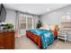 This bedroom features a large window, and vibrant accents at 3020 Imperial Oaks Dr, Raleigh, NC 27614