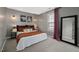 Stylish bedroom showcases modern sconces, neutral walls, and a large framed mirror at 3020 Imperial Oaks Dr, Raleigh, NC 27614