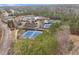 Aerial shot of community amenities including tennis courts, swimming pool, and a recreation center at 3020 Imperial Oaks Dr, Raleigh, NC 27614
