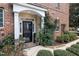 Charming brick home entrance with well-maintained landscaping and a welcoming front door at 3020 Imperial Oaks Dr, Raleigh, NC 27614