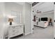 Hallway view of living room with white furniture and a decorative cabinet in the foreground at 3020 Imperial Oaks Dr, Raleigh, NC 27614