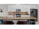 Kitchen featuring granite countertops, stainless steel appliances, and a center island with bar stool seating at 3020 Imperial Oaks Dr, Raleigh, NC 27614