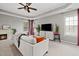 Bright living room featuring a fireplace, TV, and a comfortable sofa with decorative pillows at 3020 Imperial Oaks Dr, Raleigh, NC 27614