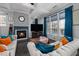 Comfortable living room featuring a fireplace, coffered ceiling, and sofas with colorful pillows at 3020 Imperial Oaks Dr, Raleigh, NC 27614