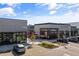 Street view of Cava restaurant storefront and other storefronts on a sunny day at 3020 Imperial Oaks Dr, Raleigh, NC 27614