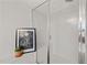 Close-up of the shower with framed botanical print at 3020 Imperial Oaks Dr, Raleigh, NC 27614