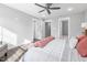 A spacious bedroom with a ceiling fan, lots of natural light and neutral-color accents at 315 E Fourth St, Wendell, NC 27591