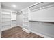 Walk-in closet with custom shelving and hanging racks for ample storage space at 315 E Fourth St, Wendell, NC 27591