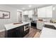 Modern kitchen with stainless steel appliances and a sleek black and white island at 315 E Fourth St, Wendell, NC 27591