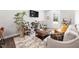 Inviting living room with patterned chairs, a decorative rug, and natural light at 315 E Fourth St, Wendell, NC 27591
