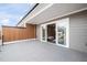 Spacious outdoor patio with sleek railings, a modern design, and a view of the living area at 315 E Fourth St, Wendell, NC 27591